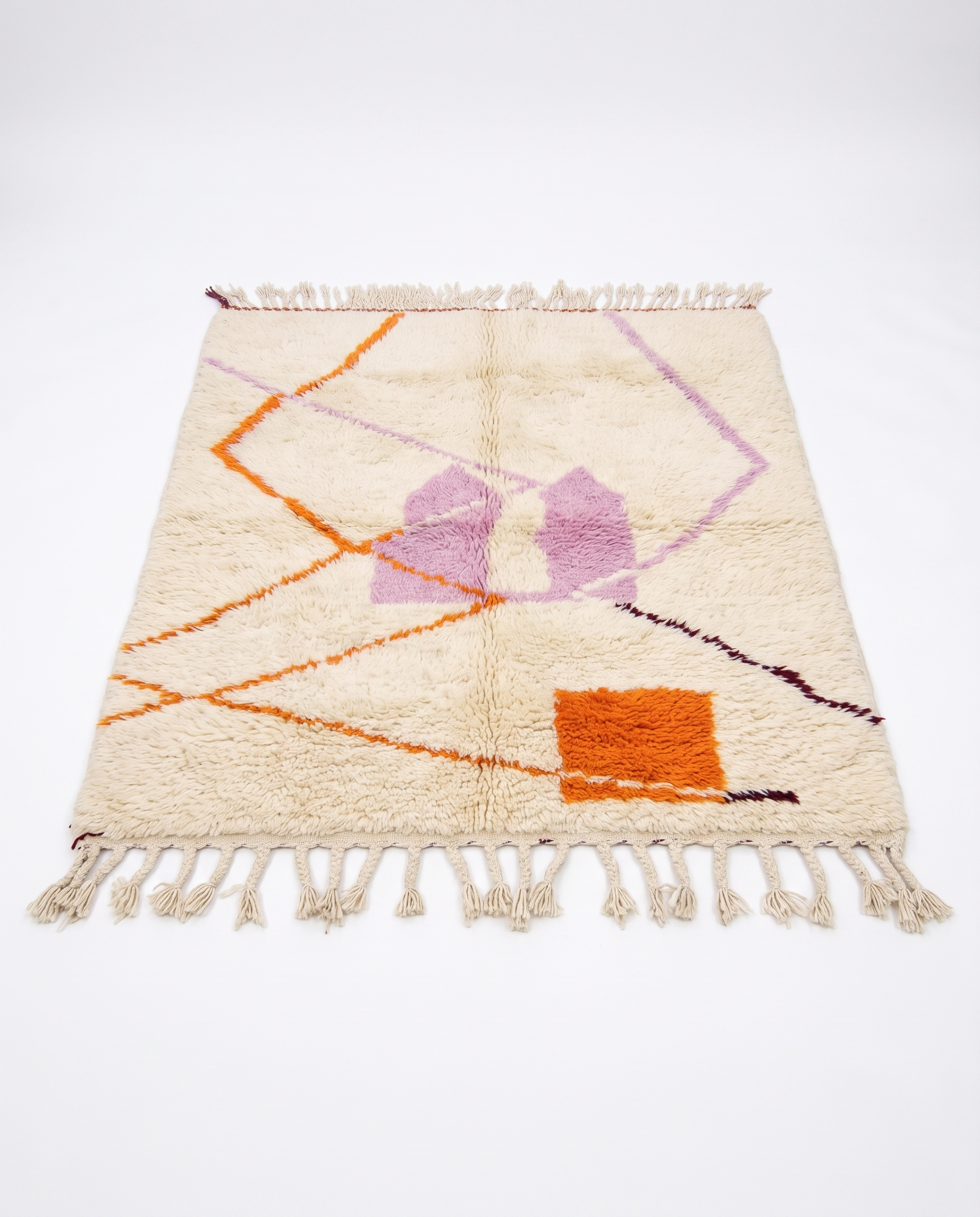 Lilac and tangerine Azilal rug full view at an angle on white studio background