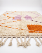 Lilac and tangerine Azilal rug side view on white studio background