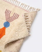 Totem Azilal rug folded corner on white studio background