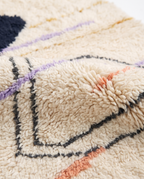 Midnight pebble Azilal rug wool texture close-up on white studio background