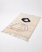 Midnight pebble Azilal rug full view at an angle on white studio background