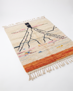 Atlas roots Azilal rug full view at an angle on white studio background