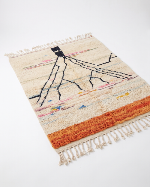 Atlas roots Azilal rug full view at an angle on white studio background