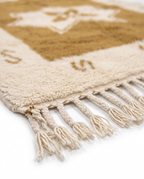 Ochre star Azilal rug fringe detail on white studio background