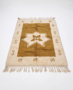 Ochre star Azilal rug full view at an angle on white studio background