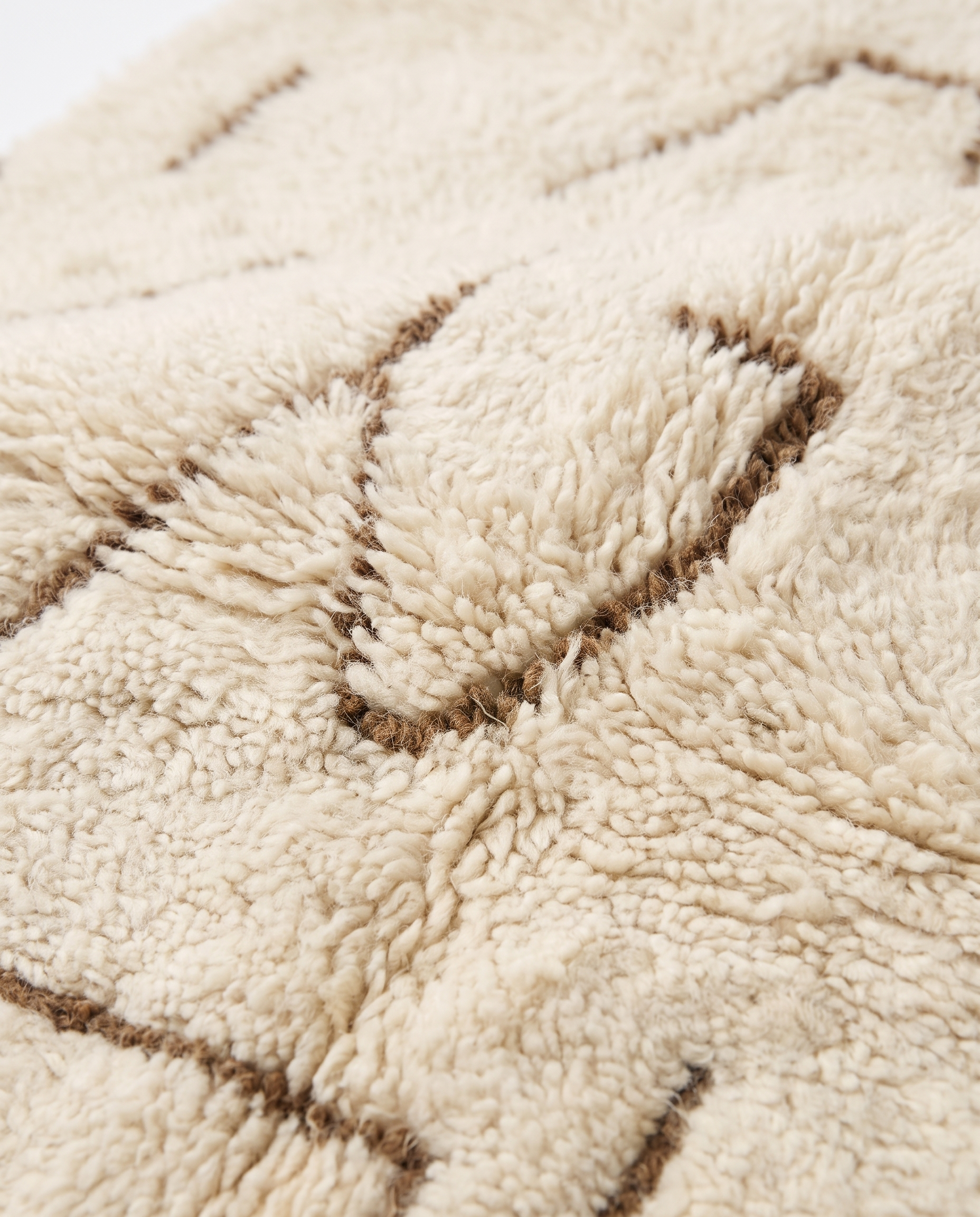 Desert lines Azilal rug wool texture close-up on white studio background