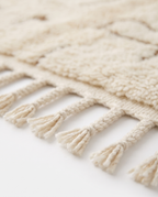 Desert lines Azilal rug fringe detail on white studio background