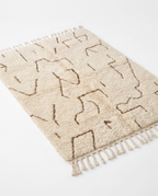 Desert lines Azilal rug full view at an angle on white studio background
