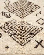 Tribal tales Azilal rug wool texture close-up on white studio background
