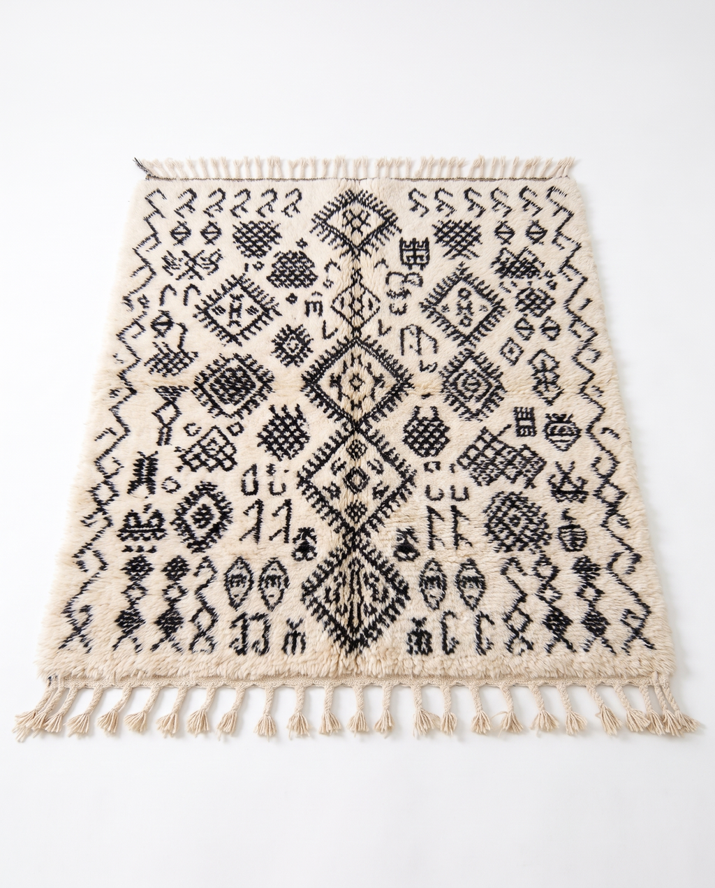 Berber script Azilal rug full view at an angle on white studio background