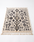 Berber script Azilal rug full view at an angle on white studio background