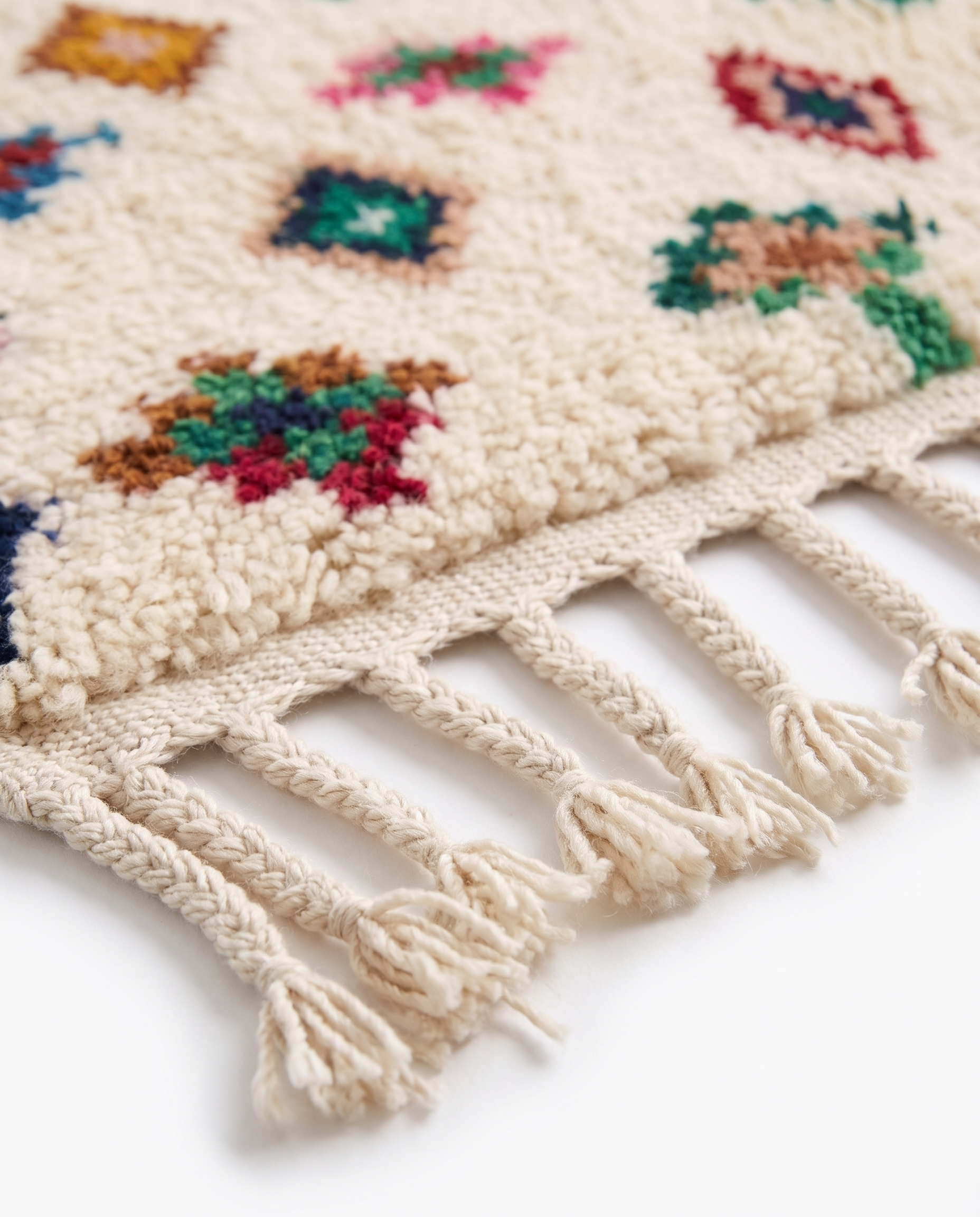 Confetti Diamonds Beni Ourain rug fringe detail on white studio background