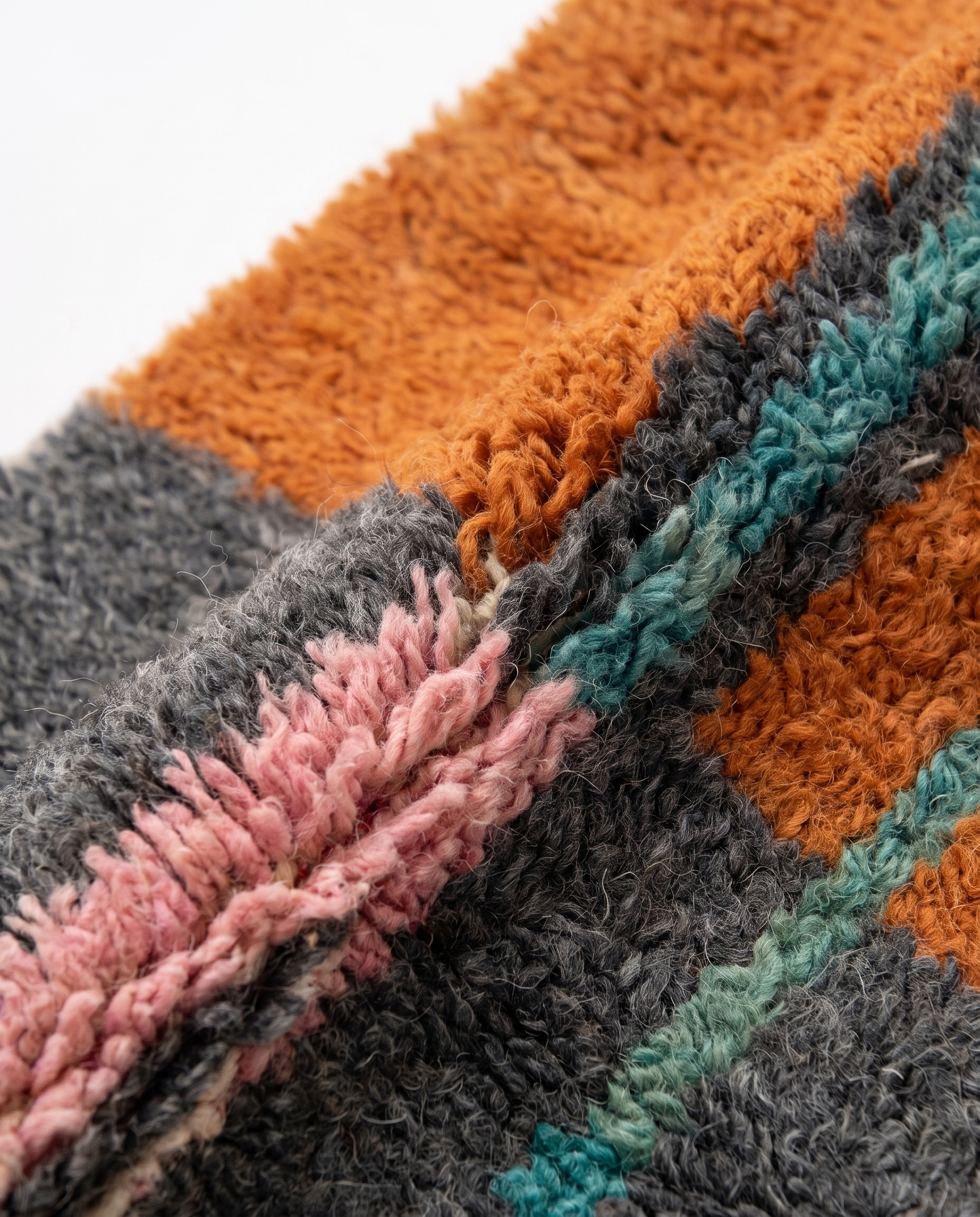 Terracotta Blocks Beni Ourain rug wool texture close-up on white studio background