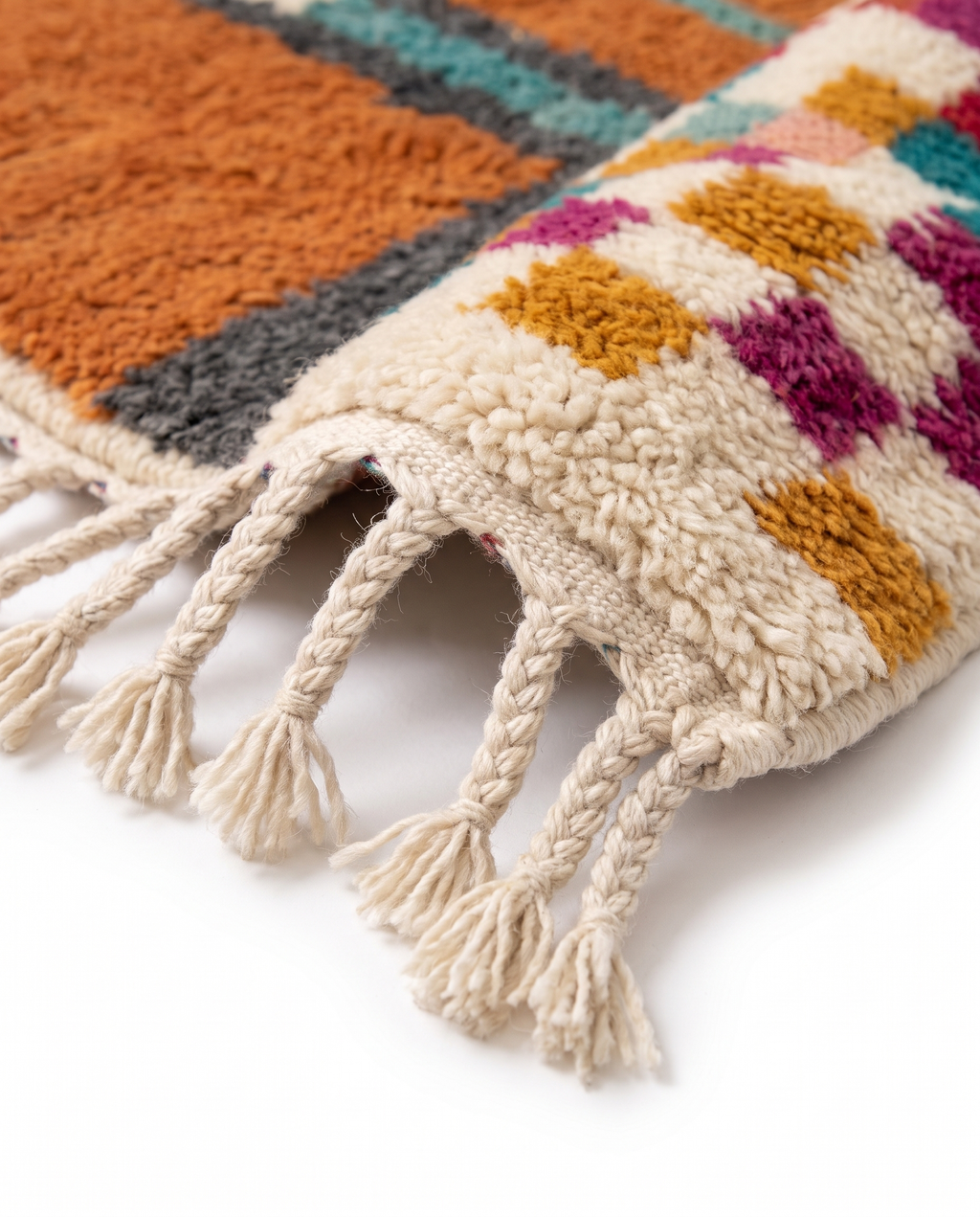 Terracotta Blocks Beni Ourain rug fringe detail on white studio background
