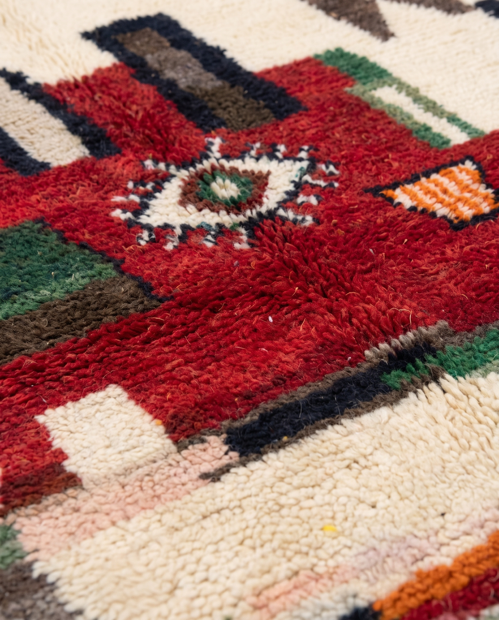 Berber Eye Beni Ourain rug wool texture close-up on white studio background