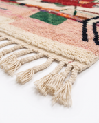 Berber Eye Beni Ourain rug fringe detail on white studio background