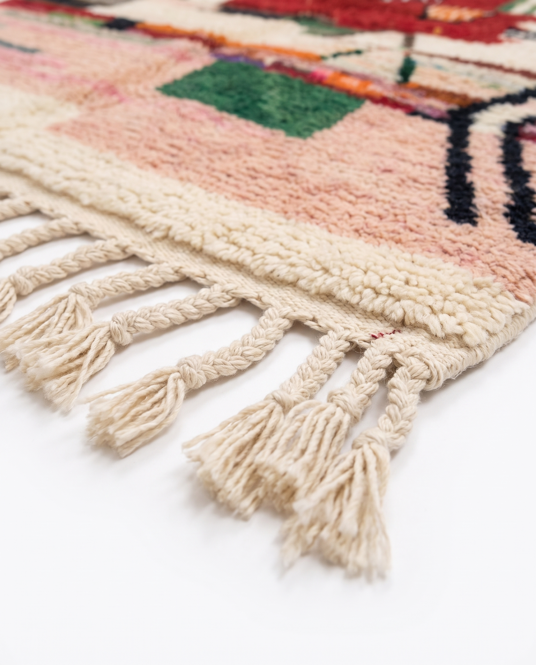 Berber Eye Beni Ourain rug fringe detail on white studio background