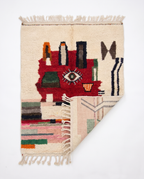 Berber Eye Beni Ourain rug folded corner on white studio background