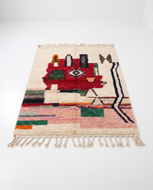 Berber Eye Beni Ourain rug full view at an angle on white studio background