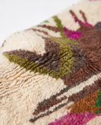 Atlas Bird Beni Ourain rug wool texture close-up on white studio background
