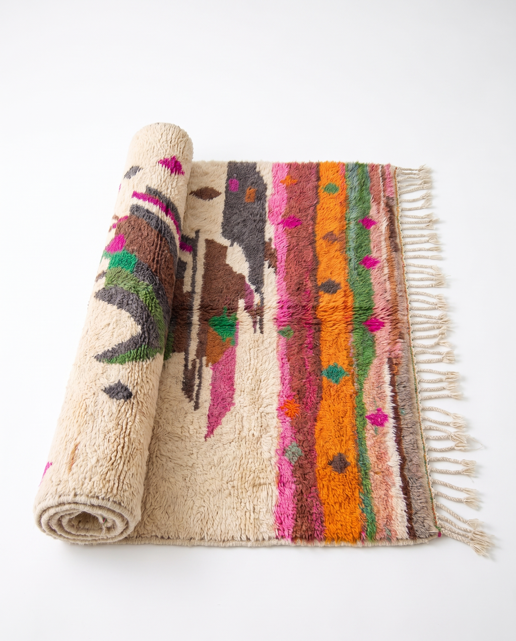 Atlas Bird Beni Ourain rug half-rolled on white studio background