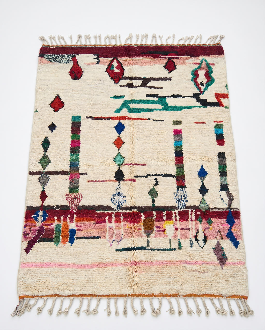 Diamond Totems Beni Ourain rug full view at an angle on white studio background