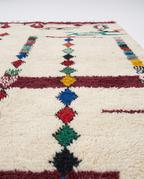 Diamond Totems Beni Ourain rug side view on white studio background