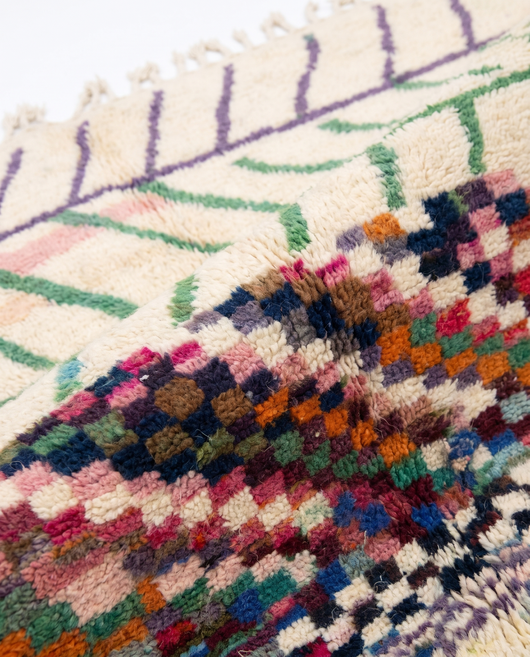 Chevron Mosaic Beni Ourain rug wool texture close-up on white studio background