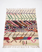 Chevron Mosaic Beni Ourain rug full view at an angle on white studio background