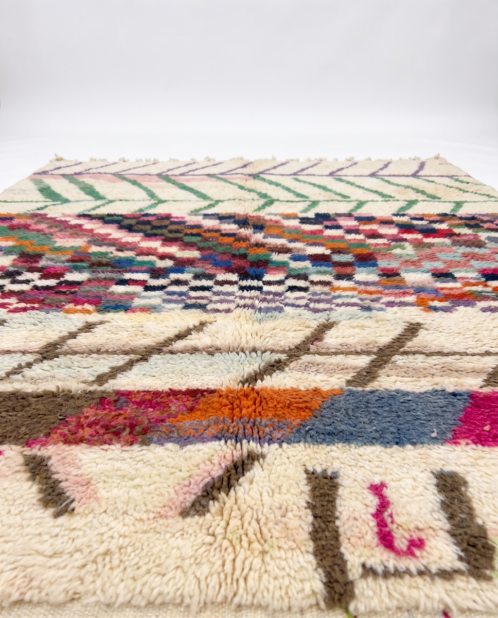 Chevron Mosaic Beni Ourain rug side view on white studio background