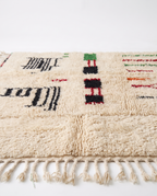 Village Signs Beni Ourain rug side view on white studio background
