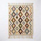 Jewel Lattice Azilal rug, handwoven wool with red, blue, green and mustard diamonds, flat lay top view