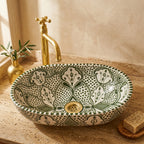 Olive Fessi Moroccan ceramic vessel sink styled on a bathroom counter in a Moroccan-inspired setting
