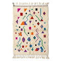 Playful Sprinkle Azilal rug, handwoven wool with scattered bright multicolor shapes, flat lay top view