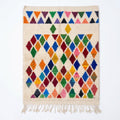 Prism Diamonds Azilal rug, handwoven wool with multicolor diamonds and triangles, flat lay top view