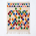 Prism Diamonds Azilal rug, handwoven wool with multicolor diamonds and triangles, flat lay top view