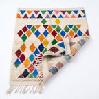 Prism Diamonds Azilal rug — folded corner showing plush pile depth