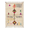 Rainbow Totem Azilal rug, handwoven wool with pink, yellow, green, blue and black scattered motifs, flat lay top view