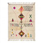 Rainbow Totem Azilal rug, handwoven wool with pink, yellow, green, blue and black scattered motifs, flat lay top view