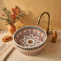 Saffron Arabesque Drum Moroccan ceramic vessel sink styled on a bathroom counter in a Moroccan-inspired setting