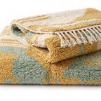 Sage & Ochre Mrirt rug — rug folded showing wool thickness