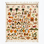 Spice Market Azilal rug, handwoven wool with orange, green, pink, blue and red tribal symbols, flat lay top view