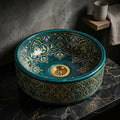 Teal and Gold Damask Drum Moroccan ceramic vessel sink on a marble counter