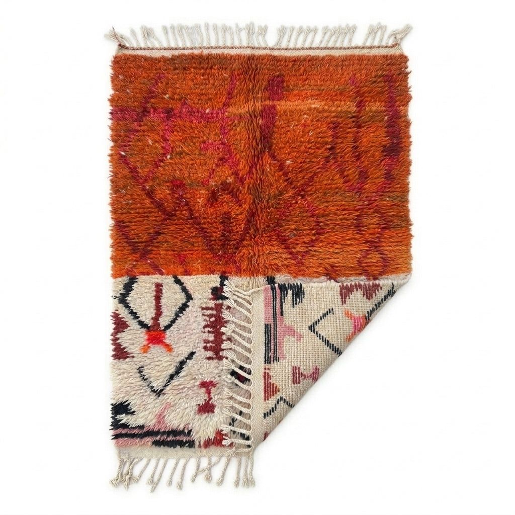 Terracotta Sky Azilal rug — folded corner showing plush pile depth