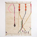 Whisper Lines Azilal rug, handwoven wool with sparse pink, orange, red and blue line motifs, flat lay top view