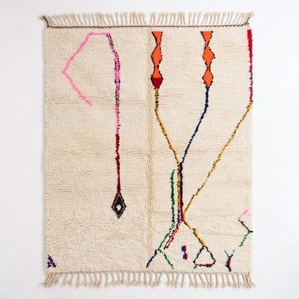 Whisper Lines Azilal rug, handwoven wool with sparse pink, orange, red and blue line motifs, flat lay top view