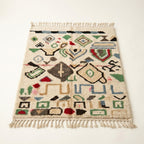 Wild Symbols Azilal rug — full rug on white studio background