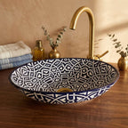Zellige Knot Oval Moroccan ceramic vessel sink styled on a bathroom counter in a Moroccan-inspired setting