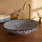 Zellige Knot Oval Moroccan ceramic vessel sink styled on a bathroom counter in a Moroccan-inspired setting