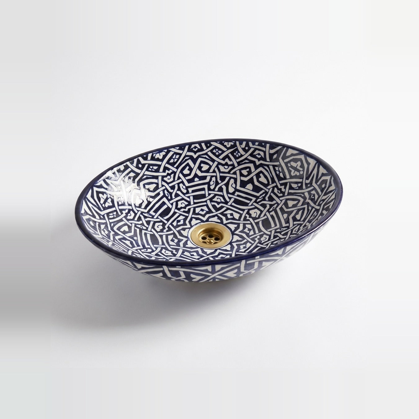 Zellige Knot Oval Moroccan ceramic vessel sink - navy interlaced zellige strapwork with brass drain